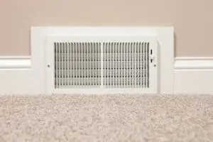 air vent at the base of a wall in a home