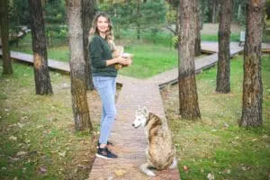 How Do I Know When It’s Time to Buy a New Furnace? Woman with dog walking