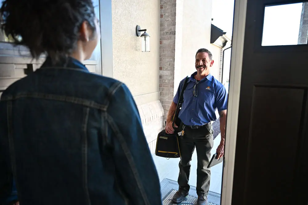 just right employee greeting someone at the door