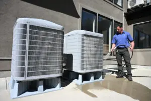 Just Right employee looking at air conditioner