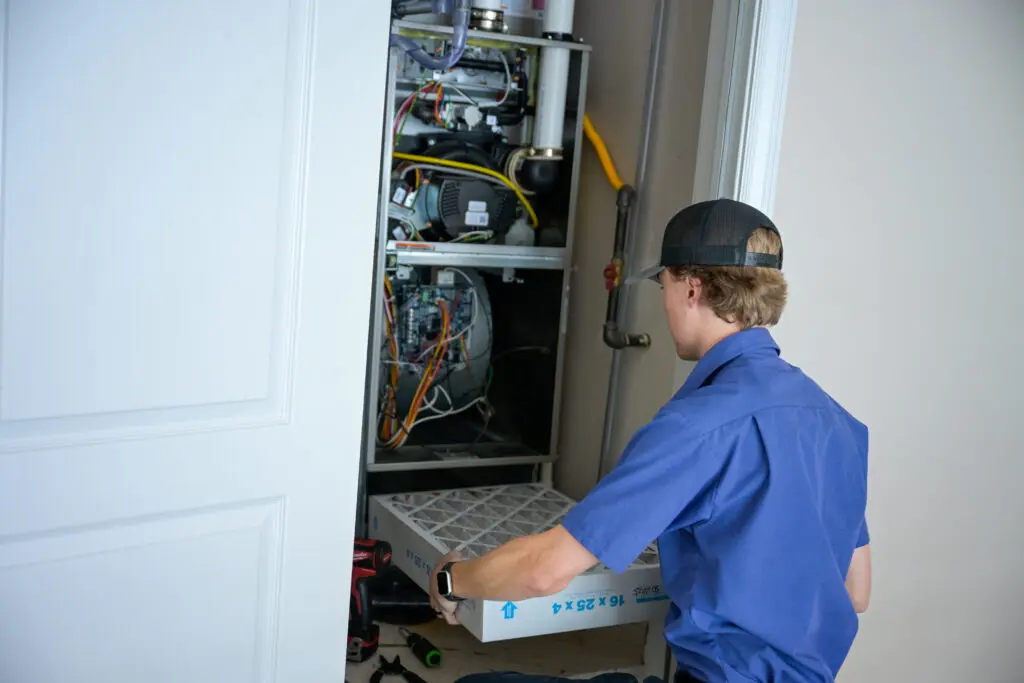 just right team member changing air filter