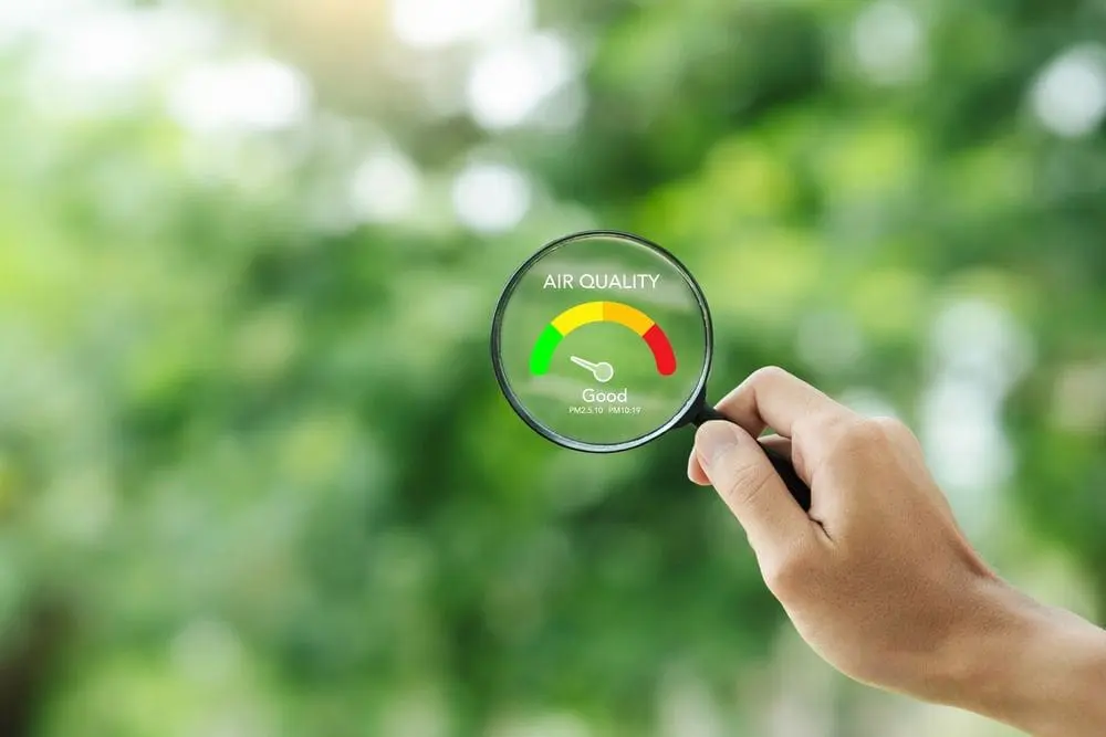 hand holding air quality magnifying glass