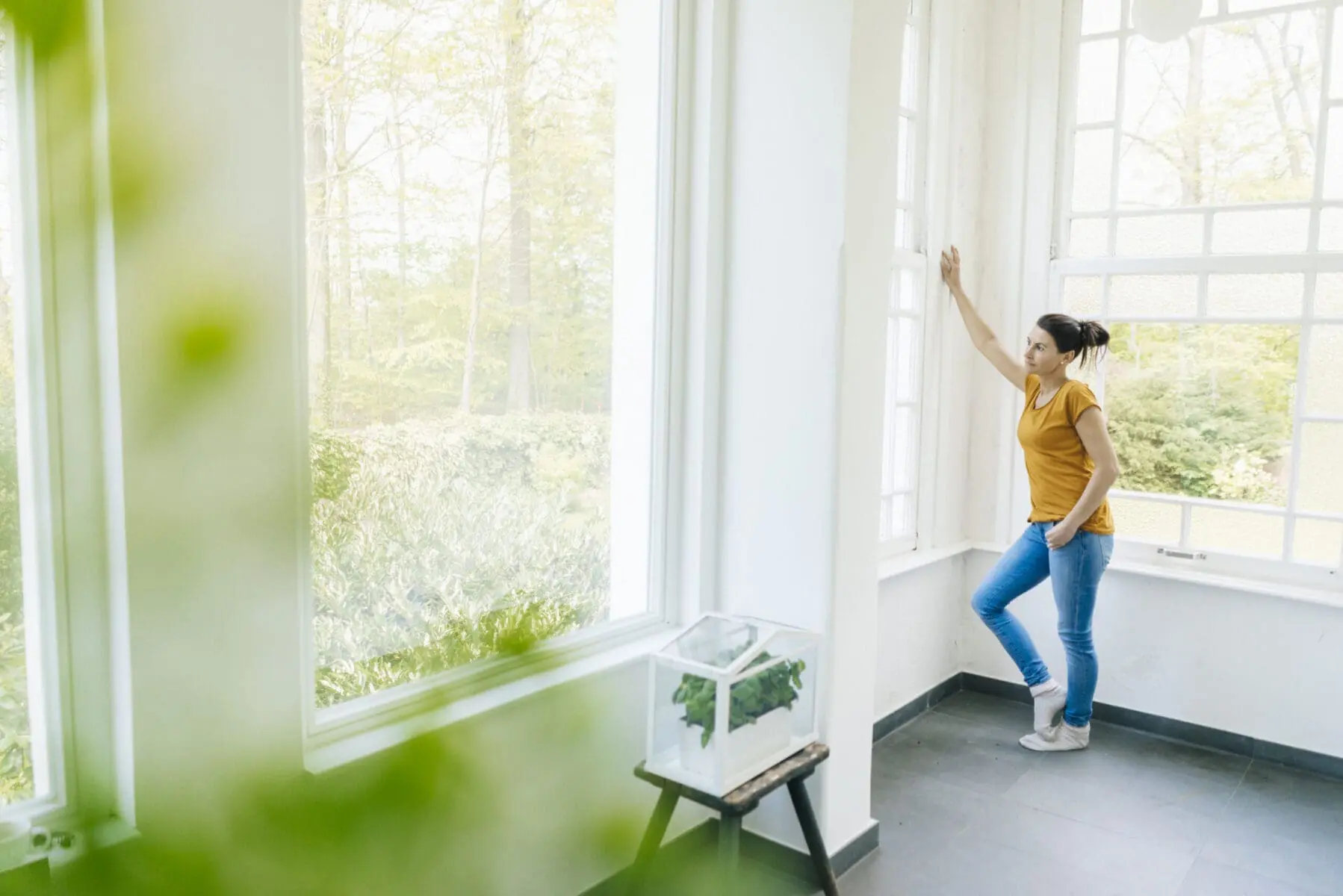 woman looking out a window