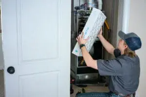 Just Right employee replacing an air filter 