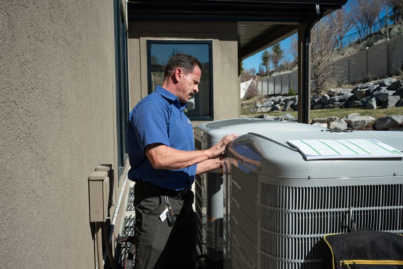 Home - Just Right technician repairing air conditioning unit