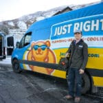 Team Member from Just Right Standing Near a Service Truck