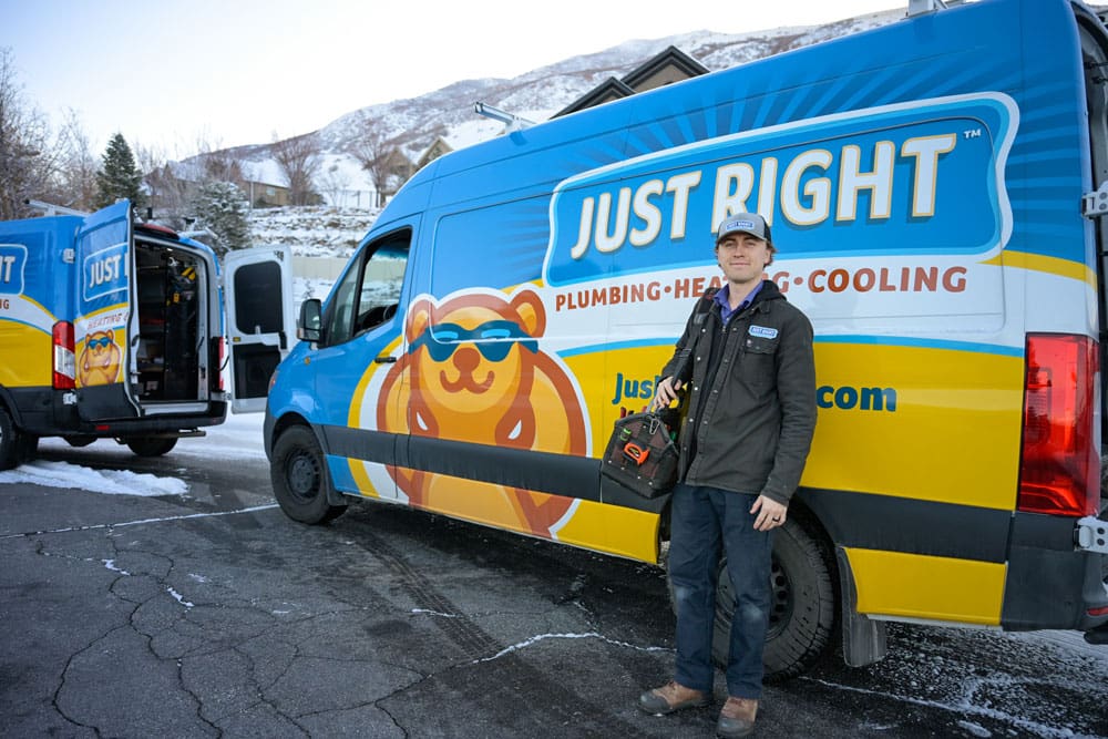 Team Member from Just Right Standing Near a Service Truck