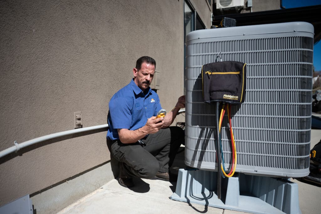 Heat Pumps - Just Right team member repairing unit