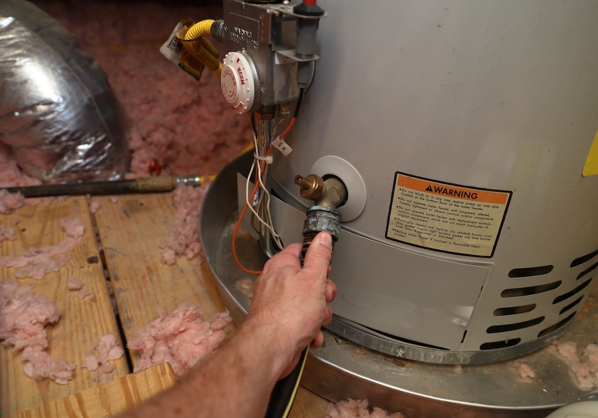 plumber working on a water heater