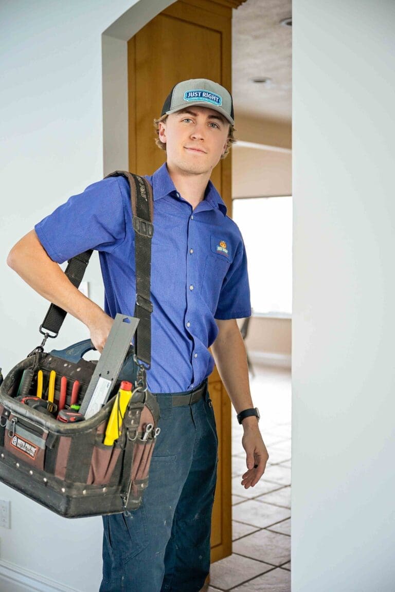 Just Right employee posing with a tool box