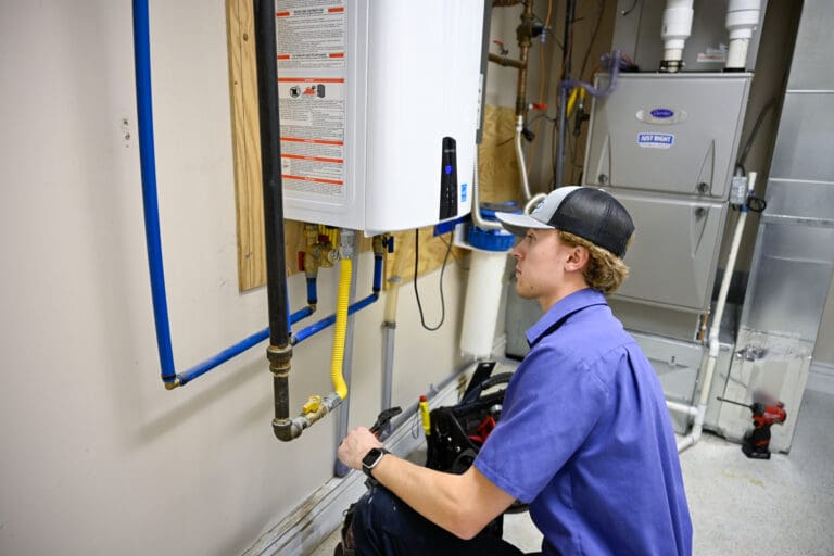 Certified plumber in Draper, UT repairing water heater system