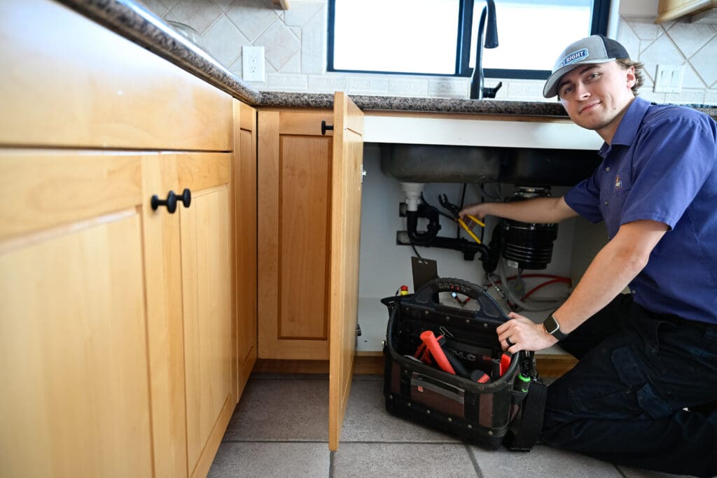 Emergency plumber near me in Weber County, UT repairing kitchen leaks