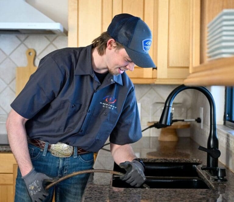 Just Right plumber snaking a drain