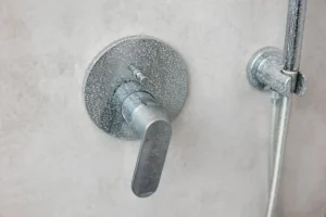 calcified water on silver shower fixture