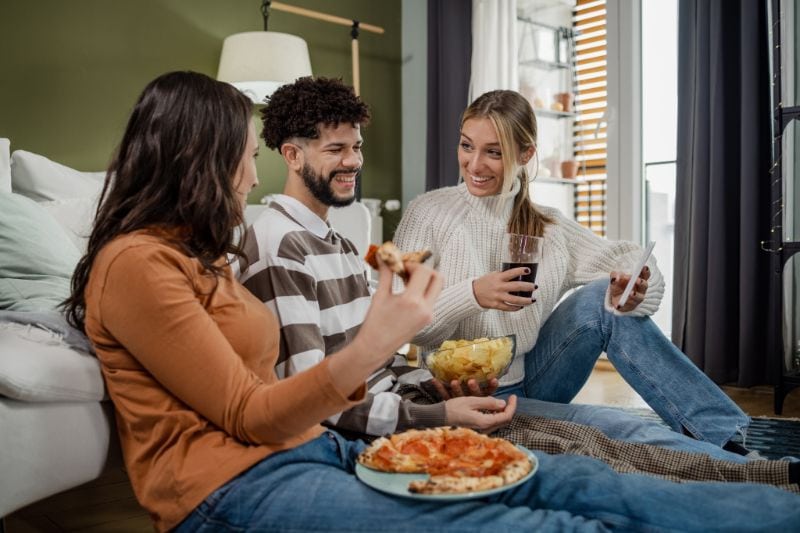 How Do I Know When I Need a New Furnace? - Friends at a Pizza Party.