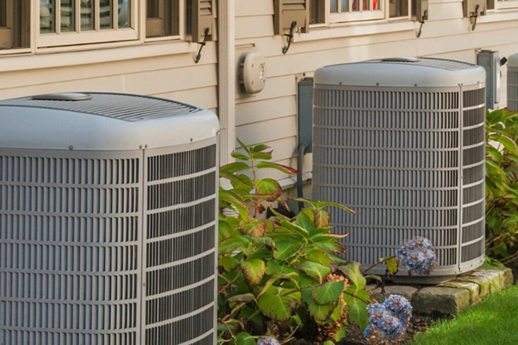 5 AC Installation Tips Every Homeowner Must Know. Air conditioner outside of a house.