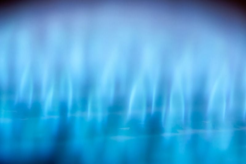 A lit furnace flame. How Does a Gas Furnace Work?